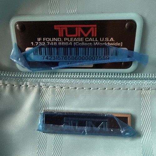 Tumi - (,
